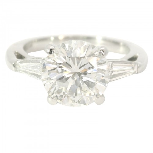 Platinum Three-Stone Diamond Engagement Ring. with 2.69 Carat Center.